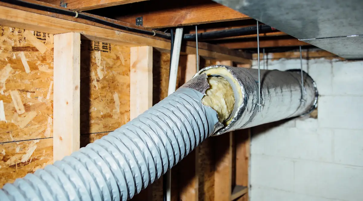 Flexible ductwork with its insulation jacket torn open