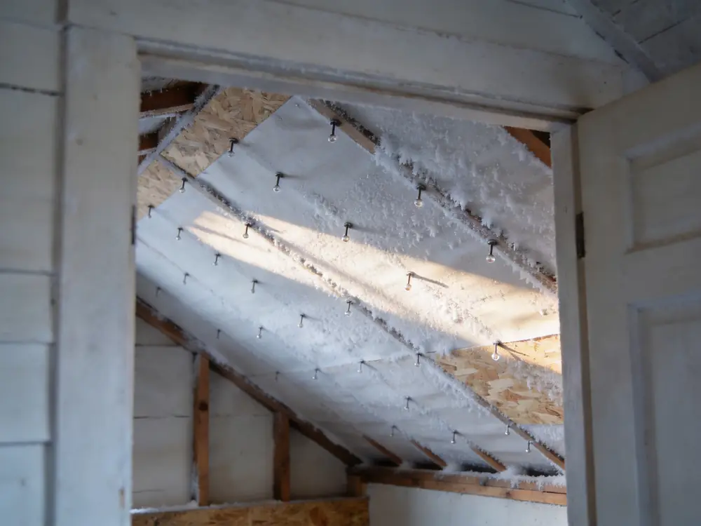 Condensation and frost on the underside of attic roof sheathing