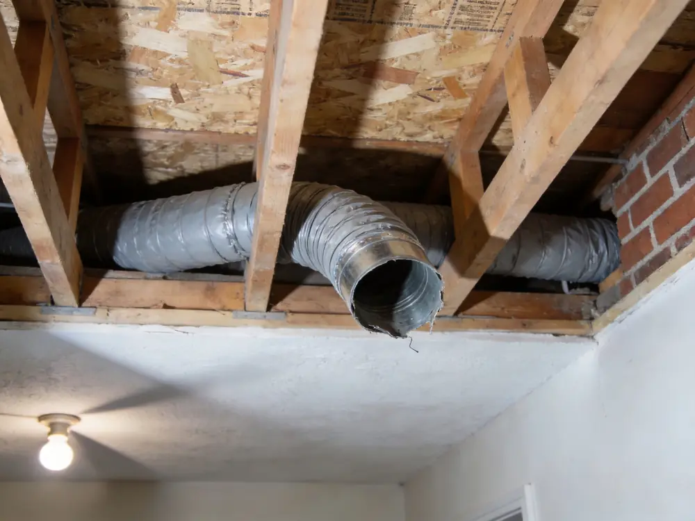 Bathroom exhaust duct venting into an attic instead of outside