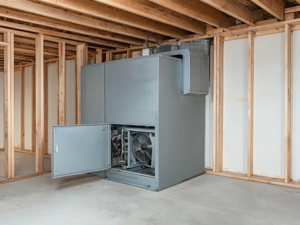 Commercial mechanical room with an air handler access panel open