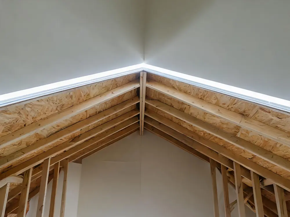 Daylight through a ridge vent along an attic peak