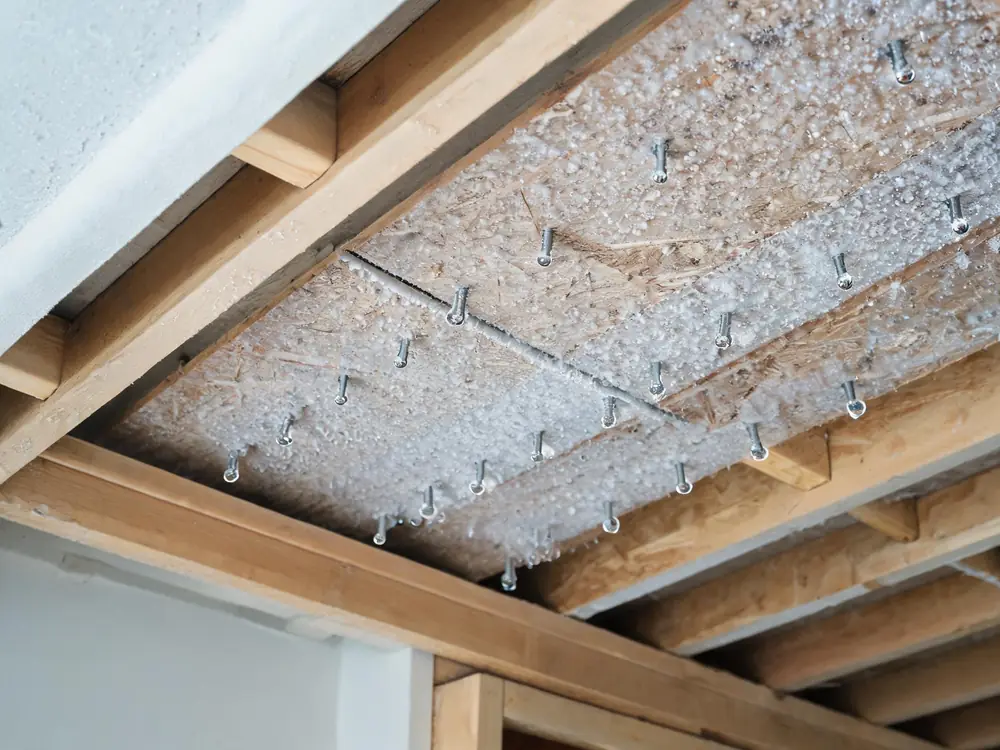 Condensation and frost on the underside of attic roof sheathing